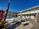 The community pool and patio area offer a relaxing spot for residents to unwind and socialize at 701 Barcelona Ave # 101, Venice, FL 34285
