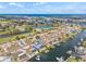 Aerial view of the waterfront home with a pool, canal access, and neighborhood views at 731 Flamingo Dr, Apollo Beach, FL 33572
