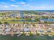 Aerial view of the waterfront home with a pool, canal access, and neighborhood views at 731 Flamingo Dr, Apollo Beach, FL 33572