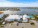 Aerial showcasing waterfront dining with water views and convenient parking at 731 Flamingo Dr, Apollo Beach, FL 33572