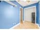 Spare bedroom with blue walls, closet, tile floors, and lots of natural light at 731 Flamingo Dr, Apollo Beach, FL 33572