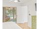 Bedroom featuring a private patio view to the pool and a dresser at 731 Flamingo Dr, Apollo Beach, FL 33572