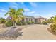 Charming single-story brick home with well-maintained landscaping, a spacious driveway, and a two-car garage at 731 Flamingo Dr, Apollo Beach, FL 33572
