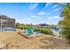 Backyard firepit area with comfortable seating and tranquil canal views at 731 Flamingo Dr, Apollo Beach, FL 33572
