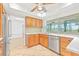 Bright kitchen with stainless steel appliances, including a dishwasher and refrigerator at 731 Flamingo Dr, Apollo Beach, FL 33572