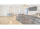 Comfortable living room and dining area featuring tile flooring, a ceiling fan, and ample natural light at 731 Flamingo Dr, Apollo Beach, FL 33572