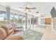 Spacious sunroom overlooking the pool, featuring tile flooring, comfortable seating, and great views at 731 Flamingo Dr, Apollo Beach, FL 33572