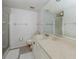 Neat bathroom with a shower and a well-lit vanity area with ample counter space at 800 Capri Isles Blvd # 124, Venice, FL 34292