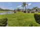 Beautifully landscaped community with clubhouse, pool, fountain pond, and tropical landscaping at 800 Capri Isles Blvd # 124, Venice, FL 34292