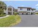 Spacious condo building with garages, private balconies, and manicured landscaping in a desirable community at 800 Capri Isles Blvd # 124, Venice, FL 34292