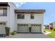 Two-car garage with decorative windows and new driveway at 800 Capri Isles Blvd # 124, Venice, FL 34292