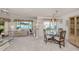Open-concept living and dining area with water view at 800 Capri Isles Blvd # 124, Venice, FL 34292