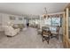 Spacious living and dining area with neutral color palette at 800 Capri Isles Blvd # 124, Venice, FL 34292