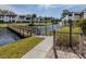 Charming community featuring a pond with fountain and wooden bridge in a lush, tropical setting at 800 Capri Isles Blvd # 124, Venice, FL 34292
