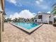 Sparkling community pool with lounge chairs and tables for residents to enjoy at 800 Capri Isles Blvd # 124, Venice, FL 34292