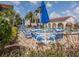 Well-maintained community pool with ample lounge seating and shaded tables at 800 Capri Isles Blvd # 124, Venice, FL 34292
