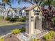 Summer Green community sign with address numbers and landscaping at 800 Capri Isles Blvd # 124, Venice, FL 34292
