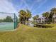 Community tennis court with peaceful canal view at 800 Capri Isles Blvd # 124, Venice, FL 34292