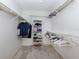 Organized walk-in closet with shelving and hanging space at 800 Capri Isles Blvd # 124, Venice, FL 34292