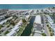 Aerial view of waterfront homes with private docks, and a canal with a house highlighted in red at 832 Whitecap Cir # 5, Venice, FL 34285