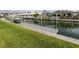 A boat is docked at the property's private dock, providing canal access at 832 Whitecap Cir # 5, Venice, FL 34285