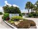 Welcome to Point Whitecap, a charming community entrance with lush landscaping and a bright, sunny day at 832 Whitecap Cir # 5, Venice, FL 34285