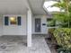 Inviting front entrance with tiled walkway and a security screen door at 832 Whitecap Cir # 5, Venice, FL 34285