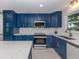 Stylish kitchen featuring stainless steel appliances and ample cabinet space at 832 Whitecap Cir # 5, Venice, FL 34285