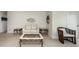 Bright living room features modern furnishings, including a plush white sofa and stylish metal and marble tables at 832 Whitecap Cir # 5, Venice, FL 34285