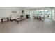 Bright living room with views of the waterfront and an open floor plan at 832 Whitecap Cir # 5, Venice, FL 34285