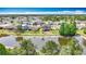 A sprawling community surrounds a beautiful home on the water with lush green landscaping at 9019 39Th Street Cir E, Parrish, FL 34219