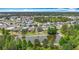 A beautiful neighborhood surrounds a scenic body of water and landscaped properties at 9019 39Th Street Cir E, Parrish, FL 34219
