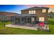 Aerial view of home with large screened-in patio, landscaped yard, and cozy fire pit area at 9019 39Th Street Cir E, Parrish, FL 34219