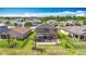 A beautiful backyard features a screened-in patio with comfortable seating and lush landscaping at 9019 39Th Street Cir E, Parrish, FL 34219