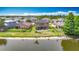 A picturesque backyard featuring a waterfront view and a screened-in patio at 9019 39Th Street Cir E, Parrish, FL 34219