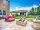 Spacious backyard features a fire pit, lounging area, and lush landscaping at 9019 39Th Street Cir E, Parrish, FL 34219