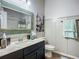 Bright bathroom with modern vanity, decorative mirror and beautiful marble countertop at 9019 39Th Street Cir E, Parrish, FL 34219