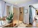 Well-lit bathroom featuring a walk-in shower, soaking tub, and a glimpse of the adjacent living space at 9019 39Th Street Cir E, Parrish, FL 34219