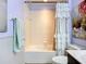 Bathroom featuring a bathtub, decorative shower curtain, and updated fixtures at 9019 39Th Street Cir E, Parrish, FL 34219