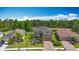Stunning home with a spacious front yard and a picturesque water view, complemented by lush landscaping and mature trees at 9019 39Th Street Cir E, Parrish, FL 34219