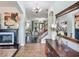 Elegant foyer with a fireplace, grand staircase, and a dazzling chandelier, creating a lasting first impression at 9019 39Th Street Cir E, Parrish, FL 34219