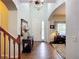 Bright and inviting foyer with soaring ceilings, stylish decor, and a view into the living area, creating a warm ambiance at 9019 39Th Street Cir E, Parrish, FL 34219