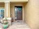 Welcoming front entrance with decorative wreath, elegant stonework, and a stylish covered porch, perfect for greeting guests at 9019 39Th Street Cir E, Parrish, FL 34219
