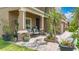 Inviting front porch with decorative potted plants, brick columns, and comfortable seating, adding charm and curb appeal at 9019 39Th Street Cir E, Parrish, FL 34219