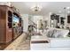 The living room features a comfortable white couch, large entertainment center, and a view of the staircase at 9019 39Th Street Cir E, Parrish, FL 34219