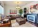 Comfortable living room features hardwood floors, stylish fireplace, leather furniture, and eye-catching wall decor at 9019 39Th Street Cir E, Parrish, FL 34219
