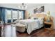 Relaxing main bedroom with a seating area by the windows and decorative touches, creating a luxurious retreat at 9019 39Th Street Cir E, Parrish, FL 34219