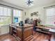 Office features a large wooden desk, window and stylish decor at 9019 39Th Street Cir E, Parrish, FL 34219