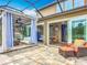 Covered patio with multiple seating areas, dining space, and seamless transition to backyard at 9019 39Th Street Cir E, Parrish, FL 34219