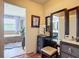 Vanity with a lighted mirror and luxurious bathroom in the background at 9019 39Th Street Cir E, Parrish, FL 34219